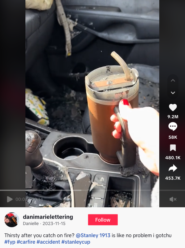 Screenshot of TikTok video of  burning car with Stanley cup inside